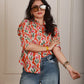 Elara orange shirt